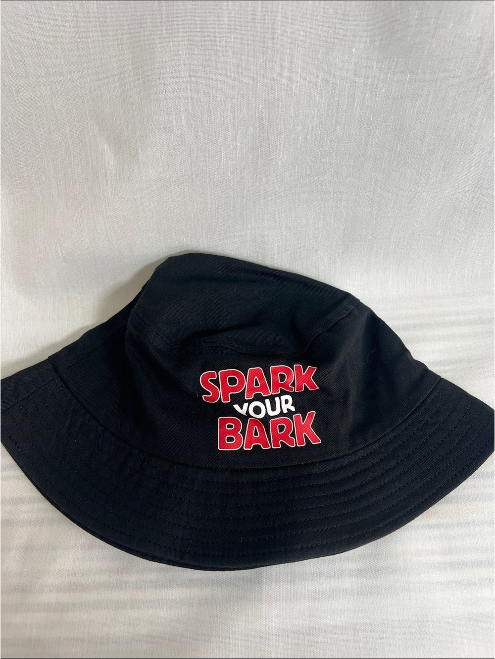 Black Bucket Hat with Spark Your Bark and Big Bark Slogan